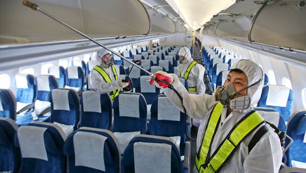 Employees from Korean Air disinfect the interior of its airplane in Incheon, South Korea, June 5, 2015 - Sputnik International