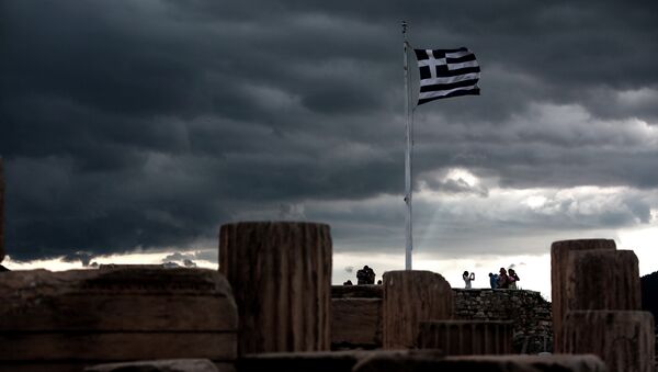 A Greek flag waves in the breeze at Acropolis hill, in Athens on June 5, 2015 - Sputnik International