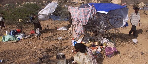 Internally displaced Eritreans sit outside their makeshift shelters at a camp in Dadu, Eritrea. Internally displaced Eritreans sit outside their makeshift shelters at a camp in Dadu, Eritrea. - Sputnik International