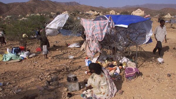 Internally displaced Eritreans sit outside their makeshift shelters at a camp in Dadu, Eritrea. - Sputnik International