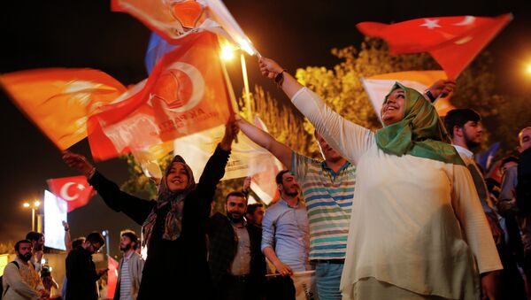 Supporters of Turkey's ruling Justice and Development Party celebrate after the election results in Istanbul, Turkey, late Sunday, June 7, 2015 - Sputnik International
