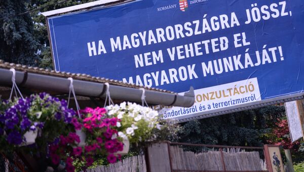A billboard with a state-funded anti-immigration poster reads in Hungarian 'If you come to Hungary, do not take the Hungarians' jobs !' at the third district of Budapest on June 8, 2015 - Sputnik International