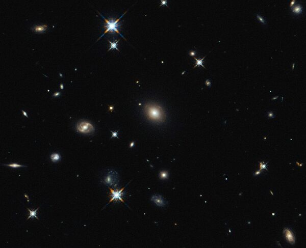 The image shows the foreground lensing galaxy (observed with Hubble), and the gravitationally lensed galaxy SDP.81, which forms an almost perfect Einstein Ring, is hardly visible. The image shows the foreground lensing galaxy (observed with Hubble), and the gravitationally lensed galaxy SDP.81, which forms an almost perfect Einstein Ring, is hardly visible. - Sputnik International