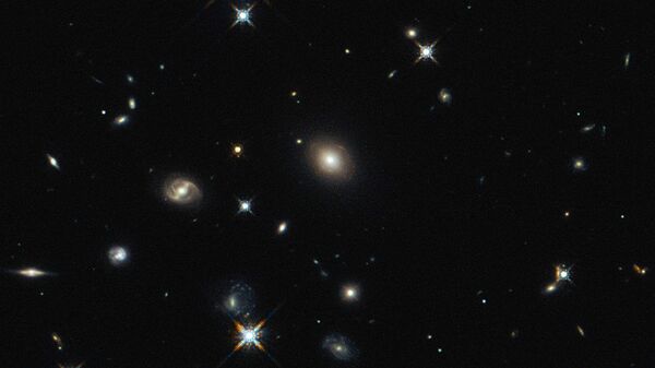 The image shows the foreground lensing galaxy (observed with Hubble), and the gravitationally lensed galaxy SDP.81, which forms an almost perfect Einstein Ring, is hardly visible. - Sputnik International