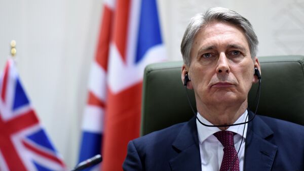 British Foreign Secretary Philip Hammond listens during a joint press conference with Saudi Foreign Minister Prince Saud bin al-Faisal bin Abdulaziz (not pictured) after a meeting on March 23, 2015 in Riyadh - Sputnik International