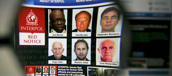 The homepage of the Interpol website is seen through a magnifying glass in this picture illustration taken in Berlin, Germany June 3, 2015 The homepage of the Interpol website is seen through a magnifying glass in this picture illustration taken in Berlin, Germany June 3, 2015 - Sputnik International