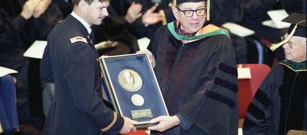 US Army Medical Corps retired Lt. Colonel John Hagmann (L) is seen being presented the William P. Clements, Jr. Outstanding Uniformed Educator Award by Dr. Sam Nixon (R) during the US Military's Uniformed Services University of the Health Sciences 1989 Commencement Exercises in this USUHS handout file photo taken in Washington May 20, 1989. US Army Medical Corps retired Lt. Colonel John Hagmann (L) is seen being presented the William P. Clements, Jr. Outstanding Uniformed Educator Award by Dr. Sam Nixon (R) during the US Military's Uniformed Services University of the Health Sciences 1989 Commencement Exercises in this USUHS handout file photo taken in Washington May 20, 1989. - Sputnik International