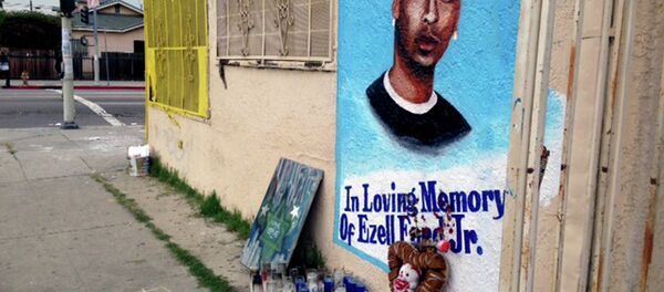 In this Dec. 30, 2014, file photo, a street side memorial with a painted portrait of Ezell Ford near where he was shot when police confronted him on Aug. 11, 2014, is shown on a street near his home in South Los Angeles. - Sputnik International
