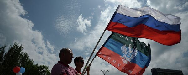 Participants at the rally in support of the Donetsk People's Republic on Lenin Square in Donetsk Participants at the rally in support of the Donetsk People's Republic on Lenin Square in Donetsk - Sputnik International
