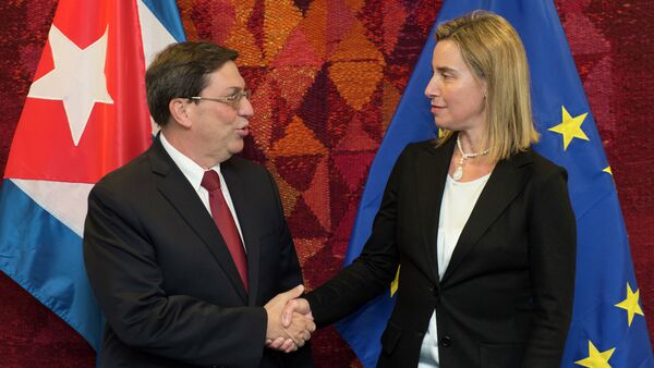 High Representative of the Union for Foreign Affairs and Security Policy and Vice-President of the Commission Federica Mogherini (R) welcomes Cuban Foreign Minister Bruno Rodríguez Parilla on April 22, 2015 before their bilateral meeting at EU headquarters in Brussels - Sputnik International