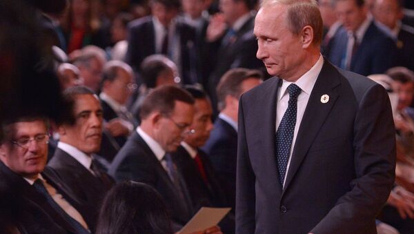 Russia's President Vladimir Putin (R) arrives as (L-R) Canada's Prime Minister Stephen Harper and US President Barack Obama look on during the 2014 G20 Summit.file photo - Sputnik International