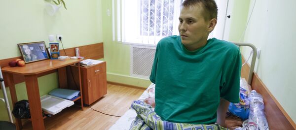 A man, who according to Ukraine's state security service (SBU) is named Alexander Alexandrov and is one of two Russian servicemen recently detained by Ukrainian forces, speaks during an interview with Reuters at a hospital in Kiev, Ukraine, May 28, 2015 - Sputnik International