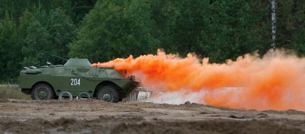An armored vehicle sets a smokescreen An armored vehicle sets a smokescreen - Sputnik International