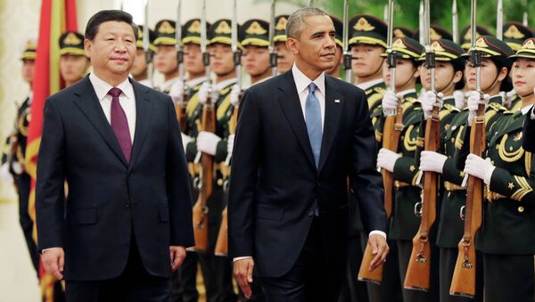 U.S. President Barack Obama and Chinese President Xi Jinping review the honor guard during a welcome ceremony at the Great Hall of the People in Beijing, Wednesday, Nov. 12, 2014. - Sputnik International