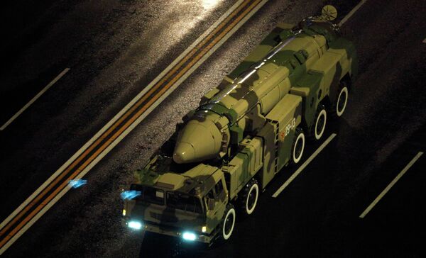 A Chinese military vehicle carries a DF21 medium range ballistic missile. A Chinese military vehicle carries a DF21 medium range ballistic missile. - Sputnik International