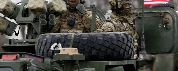 Members of US Army’s 2nd Cavalry Regiment ride on an armored vehicle Members of US Army’s 2nd Cavalry Regiment ride on an armored vehicle - Sputnik International