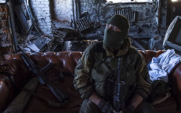 Donbass militiaman rests at his position inside the Donetsk airport, eastern Ukraine. June 9, 2015. - Sputnik International