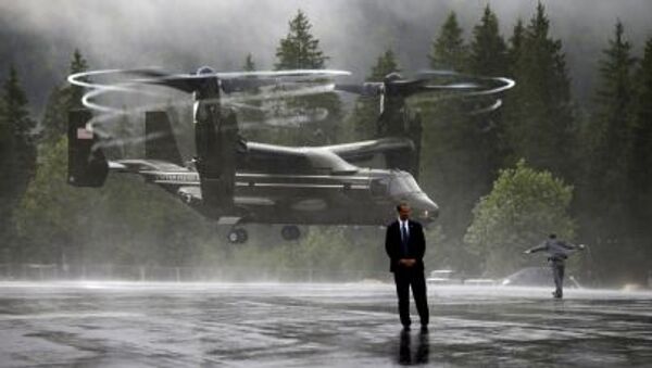 US Marine Osprey sends up a big wash of rain as as it lands near the Bavarian town of Kruen, Germany, June 8, 2015. The Ospreys provided transport to Air Force One in Munich for members of U.S. President Barack Obama's staff, Secret Service, White House Press Corps and other personnel at the conclusion of the G7 Summit - Sputnik International