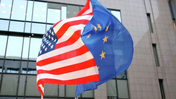 The US and EU flags, left and right, fly side by side at the European Council building in Brussels - Sputnik International