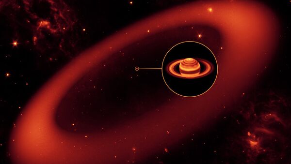 An artist’s illustration shows the grand scale of the Phoebe ring, with Saturn at its center. - Sputnik International