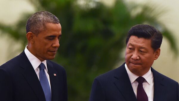 US President Barack Obama (L) walks with Chinese President Xi Jinping - Sputnik International