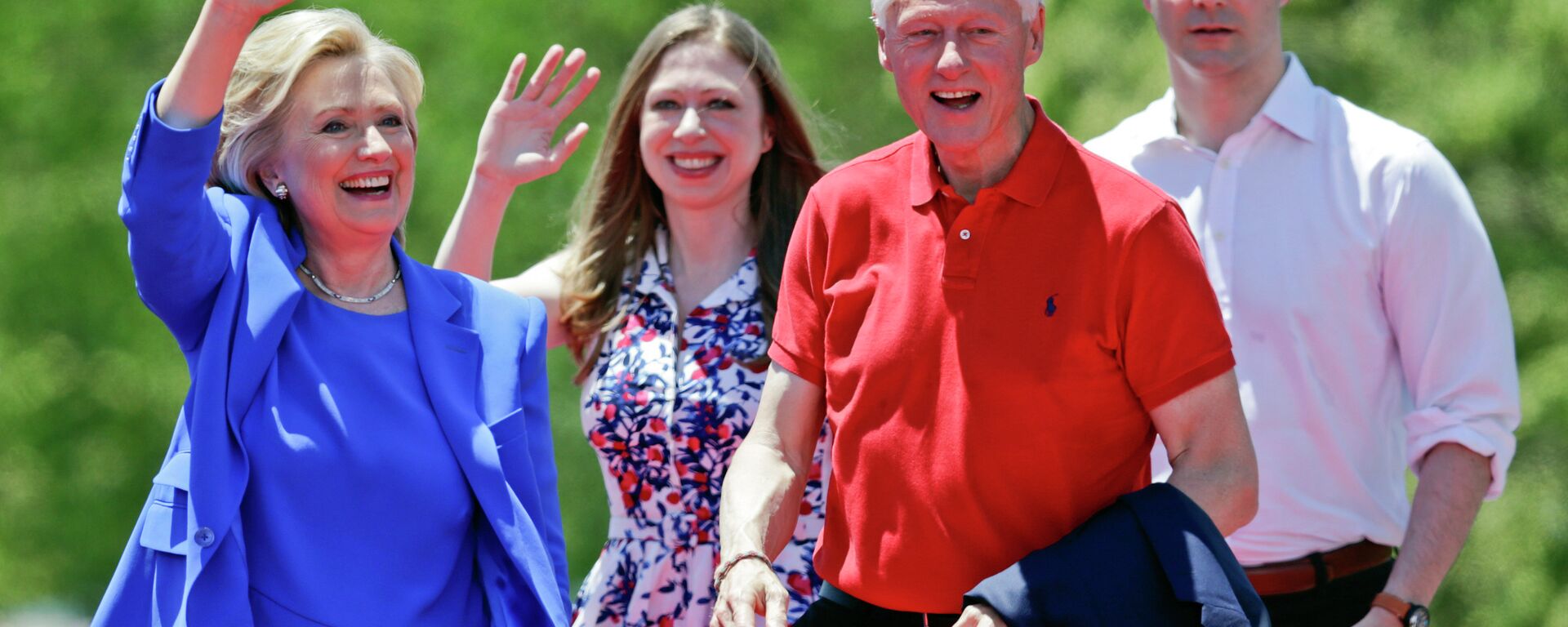 Former Secretary of State Hillary Clinton waves to supporters as her husband, former President Bill Clinton, second from right, Chelsea Clinton, second from left, and her husband Marc Mezvinsky, join her on stage Saturday, June 13, 2015, on Roosevelt Island in New York - Sputnik International, 1920, 26.09.2024