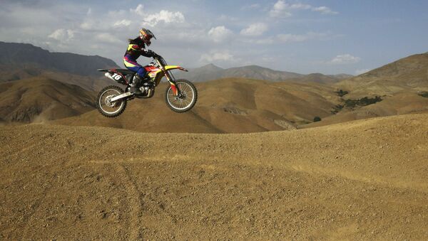 Iranian Behnaz Shafiei rides her motocross bike during her training session at a racetrack in the Alborz mountain range near the village of Baraghan, some 19 miles (30 kilometers) west of the capital Tehran, Iran - Sputnik International