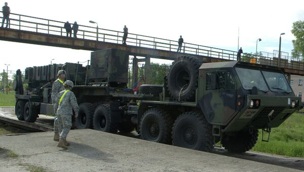 Soldiers watch a US Patriot missile being unloaded in a Polish Army military unit in Morag, northern Poland. File photo. - Sputnik International