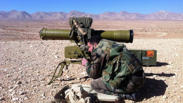 A Syrian soldier aims a rocket launcher towards rebel locations in the Qalamoun region - Sputnik International