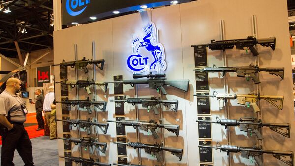 A wall of Colt M4 Carbines in various configurations are displayed at the National Rifle Association (NRA) Annual Meetings and Exhibits on April 14, 2012 in St. Louis, Missouri - Sputnik International