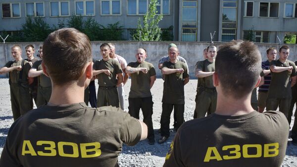 Recruits of the Ukrainian Azov regiment line-up after their final tests at a base in Kiev - Sputnik International