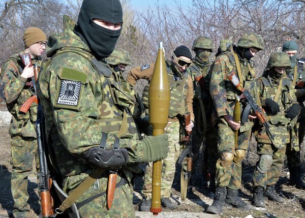 Fighters of Ukrainian volonteer Azov battalion take part in military exercises not far southeastern Ukrainian city of Mariupol, on February 27, 2015 Fighters of Ukrainian volonteer Azov battalion take part in military exercises not far southeastern Ukrainian city of Mariupol, on February 27, 2015 - Sputnik International