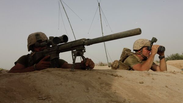 US Marine Corps snipers look for the enemy during an exchange of fire with Taliban militants in Afghanistan in August 2011. - Sputnik International