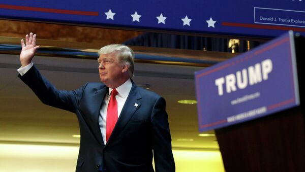 US Republican presidential candidate, real estate mogul and TV personality Donald Trump, acknowledges supporters prior to formally announcing his campaign for the 2016 Republican presidential nomination during an event at Trump Tower in New York June 16, 2015 - Sputnik International
