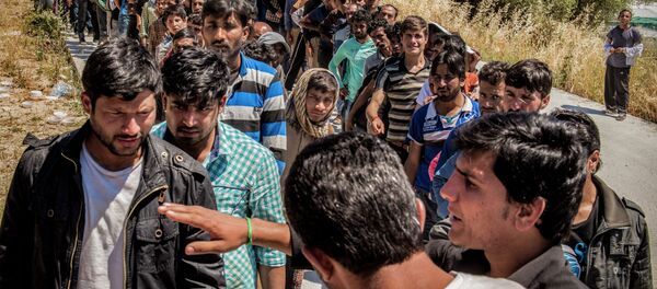 Refugees from Afghanistan are pictured on the island of Lesbos near Moria, Greece Refugees from Afghanistan are pictured on the island of Lesbos near Moria, Greece - Sputnik International