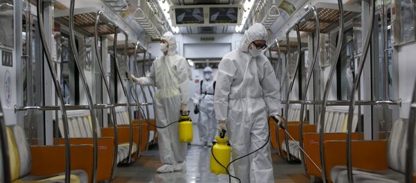 Workers in full protective gear disinfect the interior of a subway train at a Seoul Metro's railway vehicle base in Goyang, South Korea, June 9, 2015 Workers in full protective gear disinfect the interior of a subway train at a Seoul Metro's railway vehicle base in Goyang, South Korea, June 9, 2015 - Sputnik International