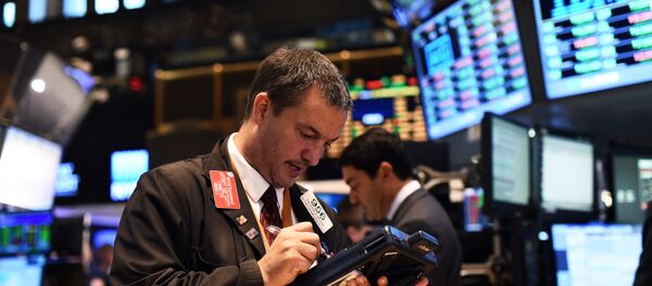A trader works on the floor of the New York Stock Exchange (NYSE) on October 17, 2014 in New York A trader works on the floor of the New York Stock Exchange (NYSE) on October 17, 2014 in New York - Sputnik International