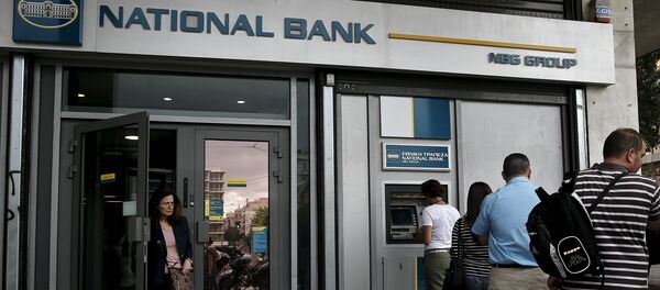 People line up at an ATM machine outside a National Bank branch in Athens People line up at an ATM machine outside a National Bank branch in Athens - Sputnik International