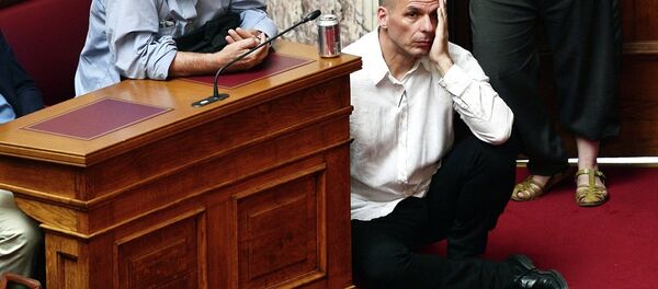 Greek Finance Minister Yianis Varoufakis (L) listens to Prime Minister addressing his MP's and ministers at the Greek Parliament in Athens on June 16, 2015. - Sputnik International