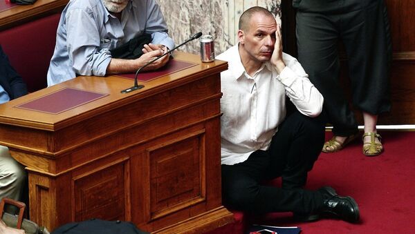 Greek Finance Minister Yianis Varoufakis (L) listens to Prime Minister addressing his MP's and ministers at the Greek Parliament in Athens on June 16, 2015. - Sputnik International