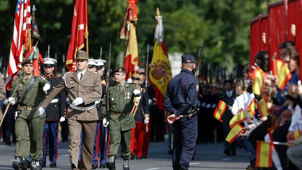 United States and NATO soldiers parade with Spanish armed forces during the National Day Parade in Madrid - Sputnik International