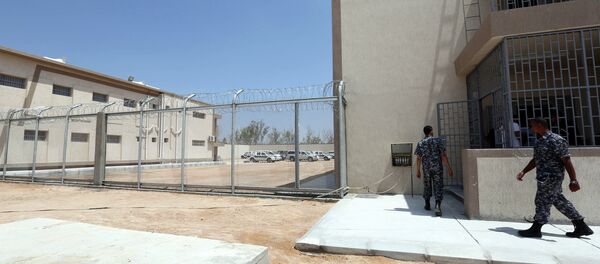 Security walk in the newly inaugurated Reform and Rehabilitation center of Al-Gauia on August 13, 2013 in Libya's coastal city of Misrata Security walk in the newly inaugurated Reform and Rehabilitation center of Al-Gauia on August 13, 2013 in Libya's coastal city of Misrata - Sputnik International