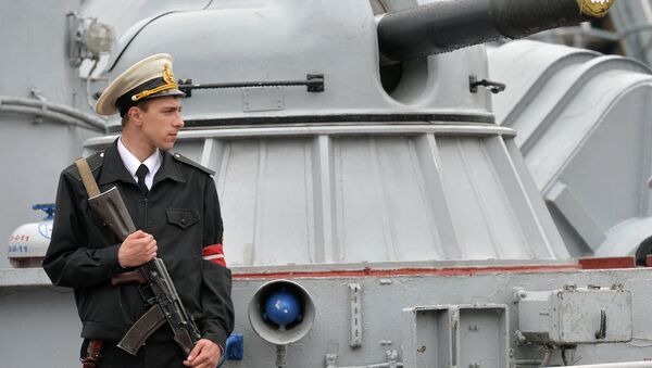 An Ukrainian sailor stands guard on Priluki missile boat in southern Ukrainian city Odessa on May 3, 2015 - Sputnik International