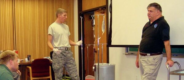 Dr. John Hagmann, right, teaches a course in treating battlefield trauma in this handout photograph taken around 2010 and released on June 17, 2015. Dr. John Hagmann, right, teaches a course in treating battlefield trauma in this handout photograph taken around 2010 and released on June 17, 2015. - Sputnik International