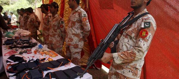 Paramilitary Soldiers display weapons and materials used in making bombs, seized during an operation, during a press briefing at Rangers Headquarter Karachi, Pakistan, May 26, 2015 Paramilitary Soldiers display weapons and materials used in making bombs, seized during an operation, during a press briefing at Rangers Headquarter Karachi, Pakistan, May 26, 2015 - Sputnik International