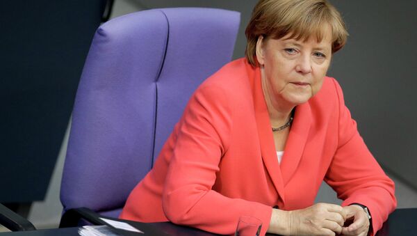 German Chancellor Angela Merkel listens to a debate of the German federal parliament, Bundestag, in Berlin, Germany, Thursday, June 18, 2015 - Sputnik International