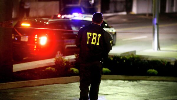 An FBI agent walks across the street from the Emanuel AME Church following a shooting Wednesday, June 17, 2015, in Charleston, S.C. - Sputnik International