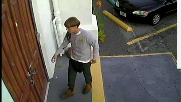 A suspect which police are searching for in connection with the shooting of several people at a church in Charleston, South Carolina is seen in a still image from CCTV footage released by the Charleston Police Department June 18, 2015 - Sputnik International