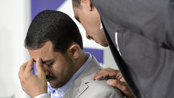 Head of the Yemeni Ansarullah rebel's delegation Hamza al-Houthi (L) gestures during a press conference on Yemen peace talks in Geneva on June 18, 2015 - Sputnik International