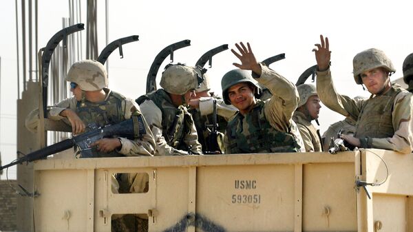 US Marines wave goodbye as they leave the military headquarters in Najaf in central Iraq, 23 September 2003 - Sputnik International